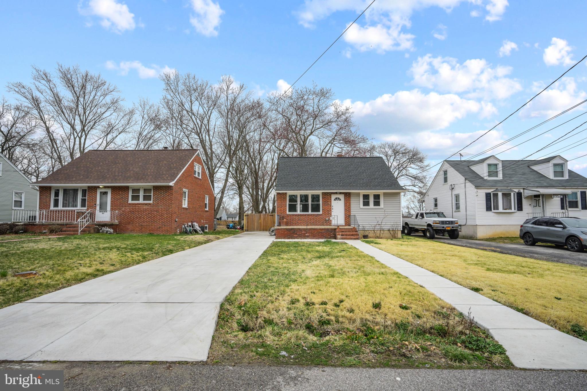 323 Wye Road Essex, MD 21221 - Photo 1 of 35 a front view of a house with garden