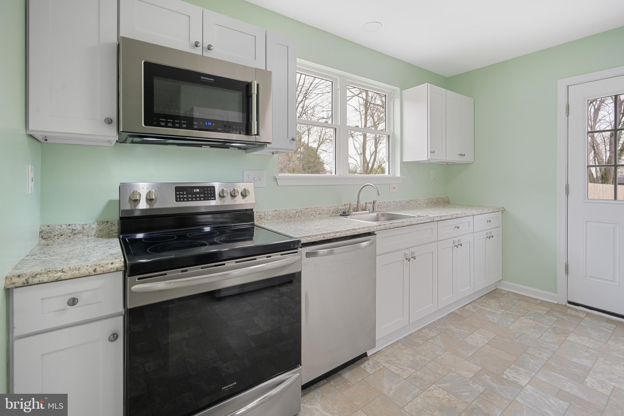 323 Wye Road Essex, MD 21221 - Photo 28 of 35 a kitchen with cabinets appliances and a window