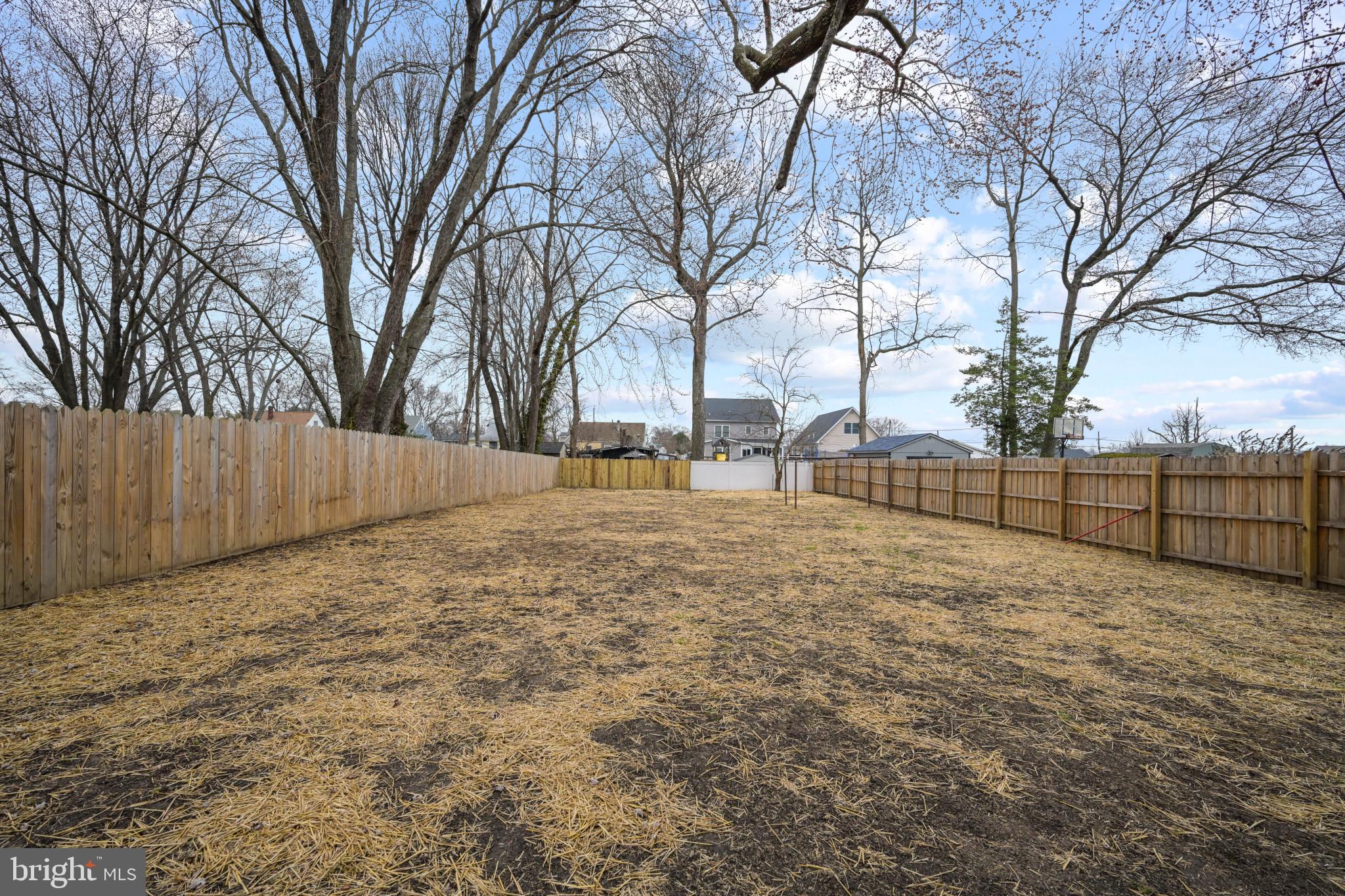 323 Wye Road Essex, MD 21221 - Photo 33 of 35 a view of backyard space with wooden fence