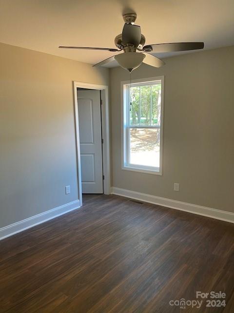 1545 West Ridge Road Salisbury, NC 28147 - Photo 11 of 18 an empty room with wooden floor chandelier fan and windows