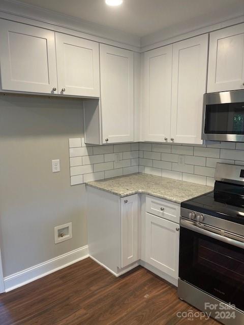 1545 West Ridge Road Salisbury, NC 28147 - Photo 6 of 18 a kitchen with granite countertop cabinets stainless steel appliances and wooden floor