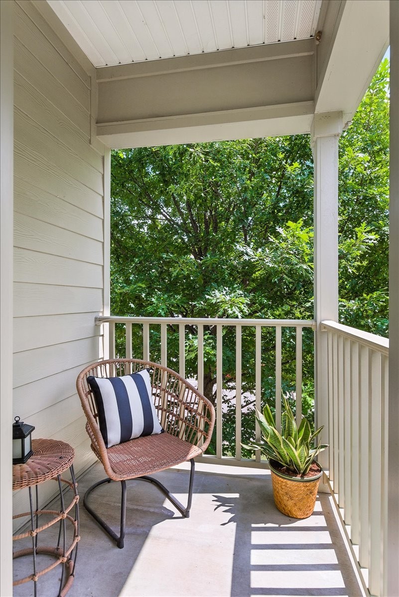 414 Rosedale Avenue, Unit 211 Nashville, TN 37211 - Photo 12 of 23 a balcony with wooden floor and outdoor seating