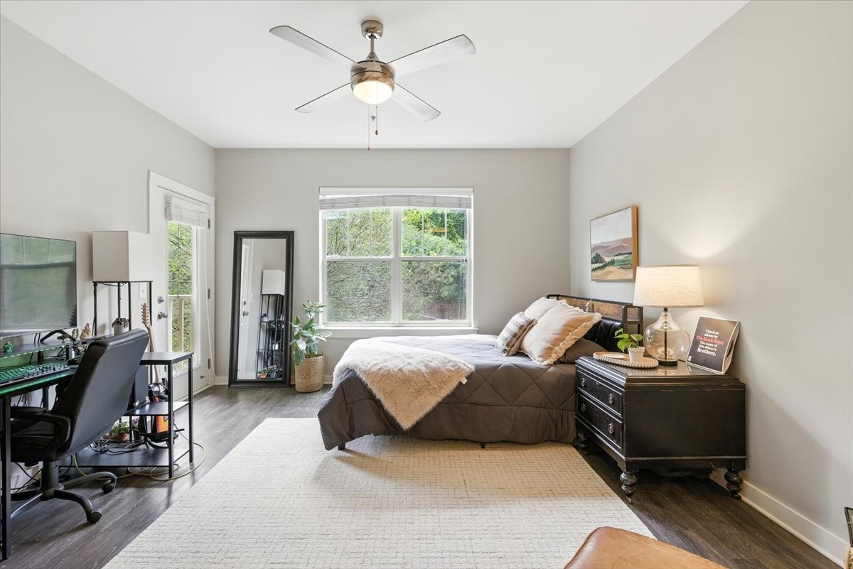 414 Rosedale Avenue, Unit 211 Nashville, TN 37211 - Photo 8 of 23 a bedroom with a bed gym equipment and a desk