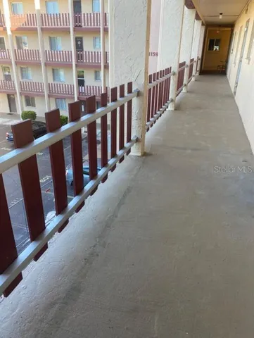 a view of a porch with wooden floor