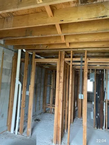 a view of a hallway with wooden shelves