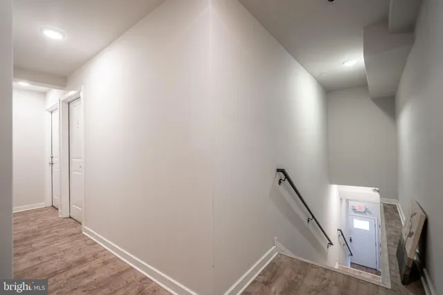 a couple of cars parked in front of a building