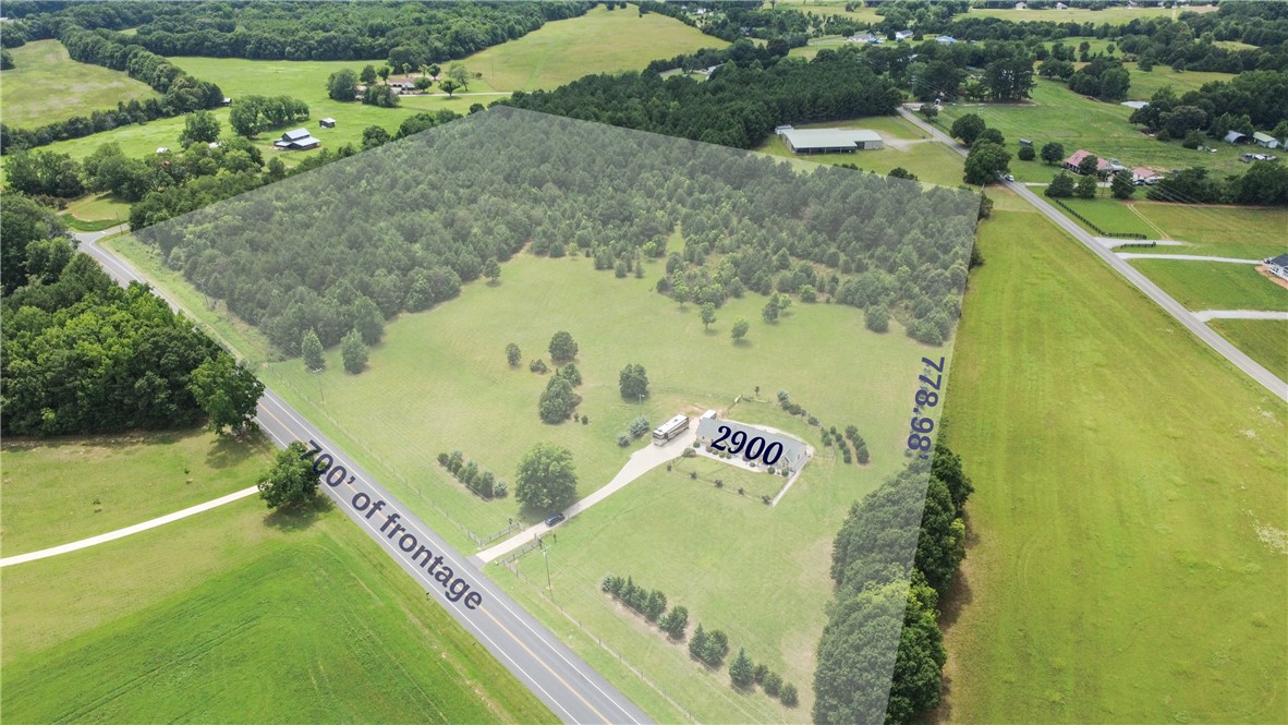 2900 Highway 187 Anderson, SC 29626 - Photo 40 of 41 An aerial perspective reveals a vast parcel of land with lush woodlands and open fields, offering a tranquil country setting.