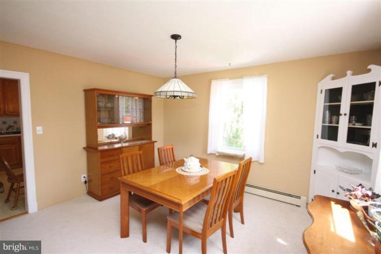 500 Forest View Road Linthicum Heights, MD 21090 - Photo 3 of 22 a dining room with furniture a chandelier and window