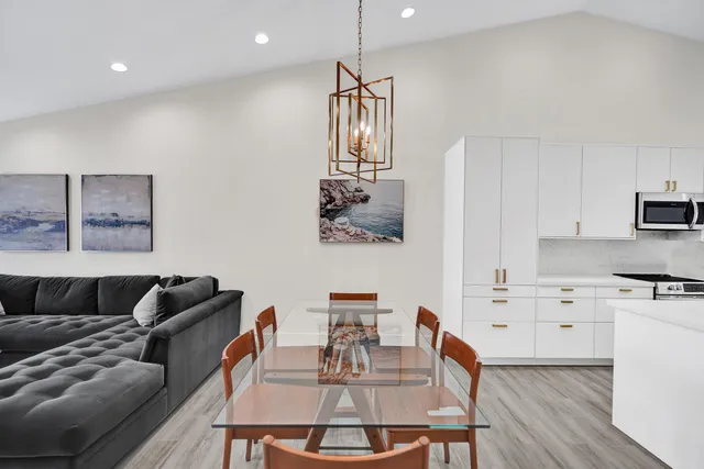 a spacious bedroom with a bed and a flat screen tv