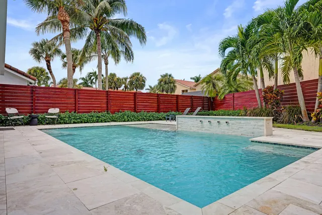 a kitchen with stainless steel appliances granite countertop a sink a stove and a microwave