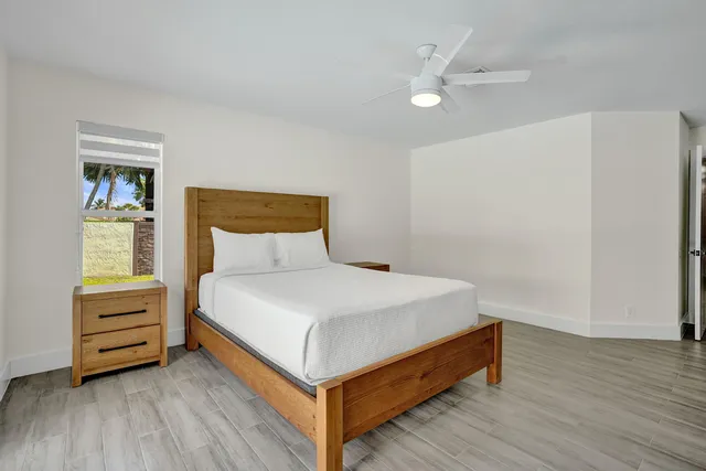 a front view of house with yard and sign board