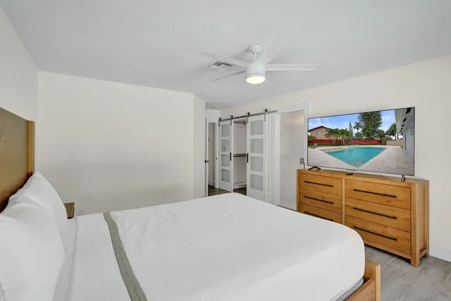 a front view of a house with garden and patio