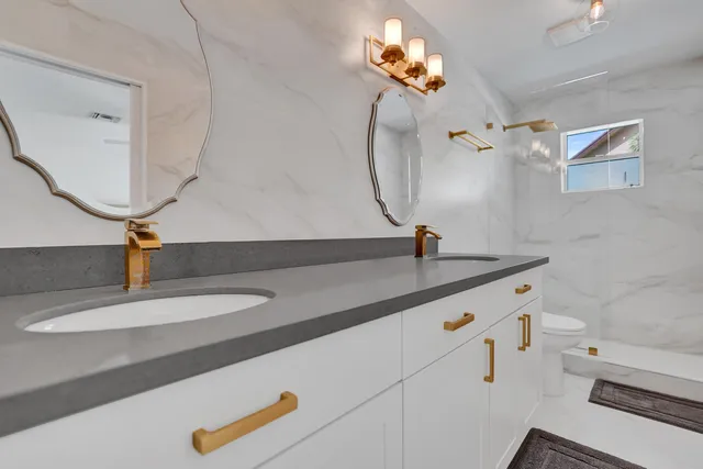 an aerial view of a house with garden space and street view