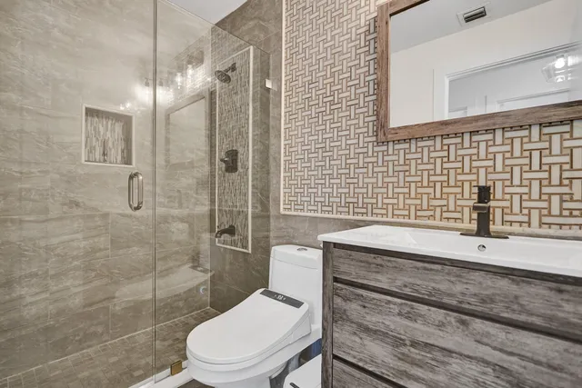 an aerial view of residential house with outdoor space and swimming pool