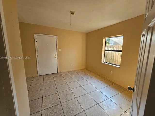 a view of an empty room and window