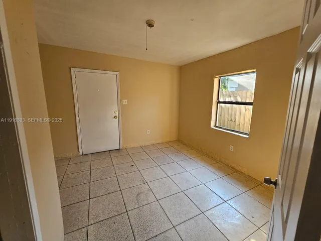 a view of an empty room and window