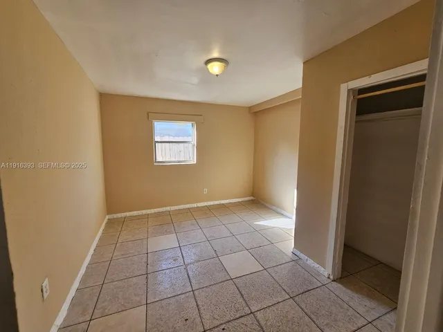 a view of an empty room and window
