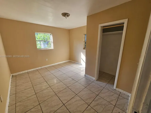 a view of an empty room and window
