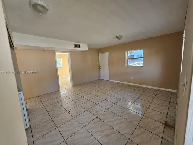 a view of an empty room and window