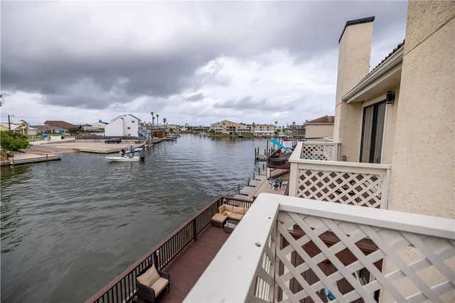 a view of a house with pool and wooden floor