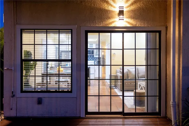 a view of a roof deck with table and chairs