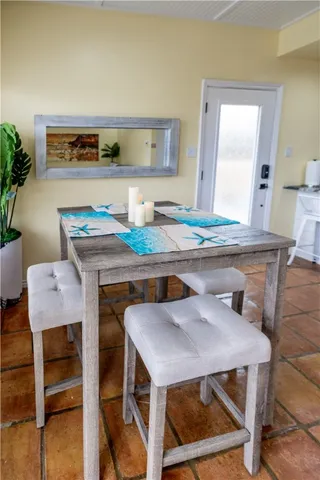 a dining room with a table and chairs