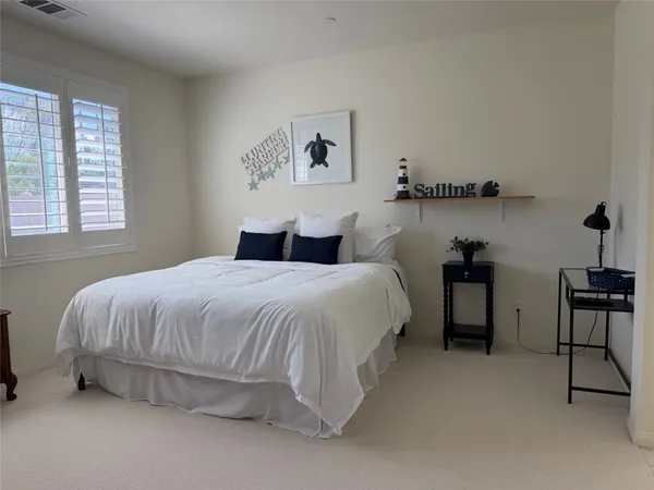 a bathroom with a bathtub sink vanity and mirror