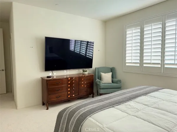 a spacious bathroom with a bathtub and a shower