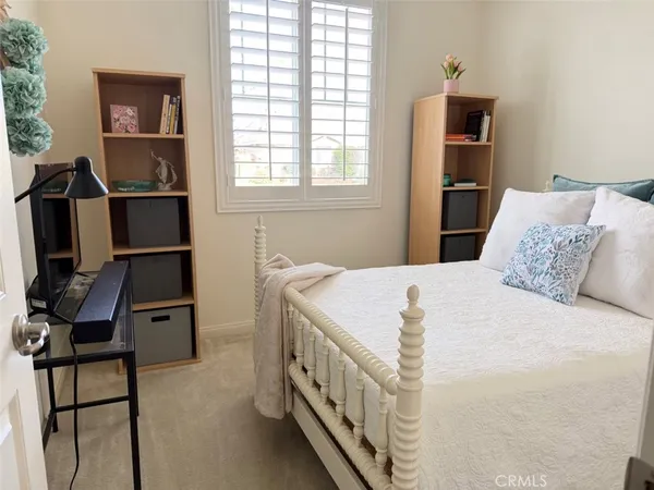 a bedroom with a bed and a shower