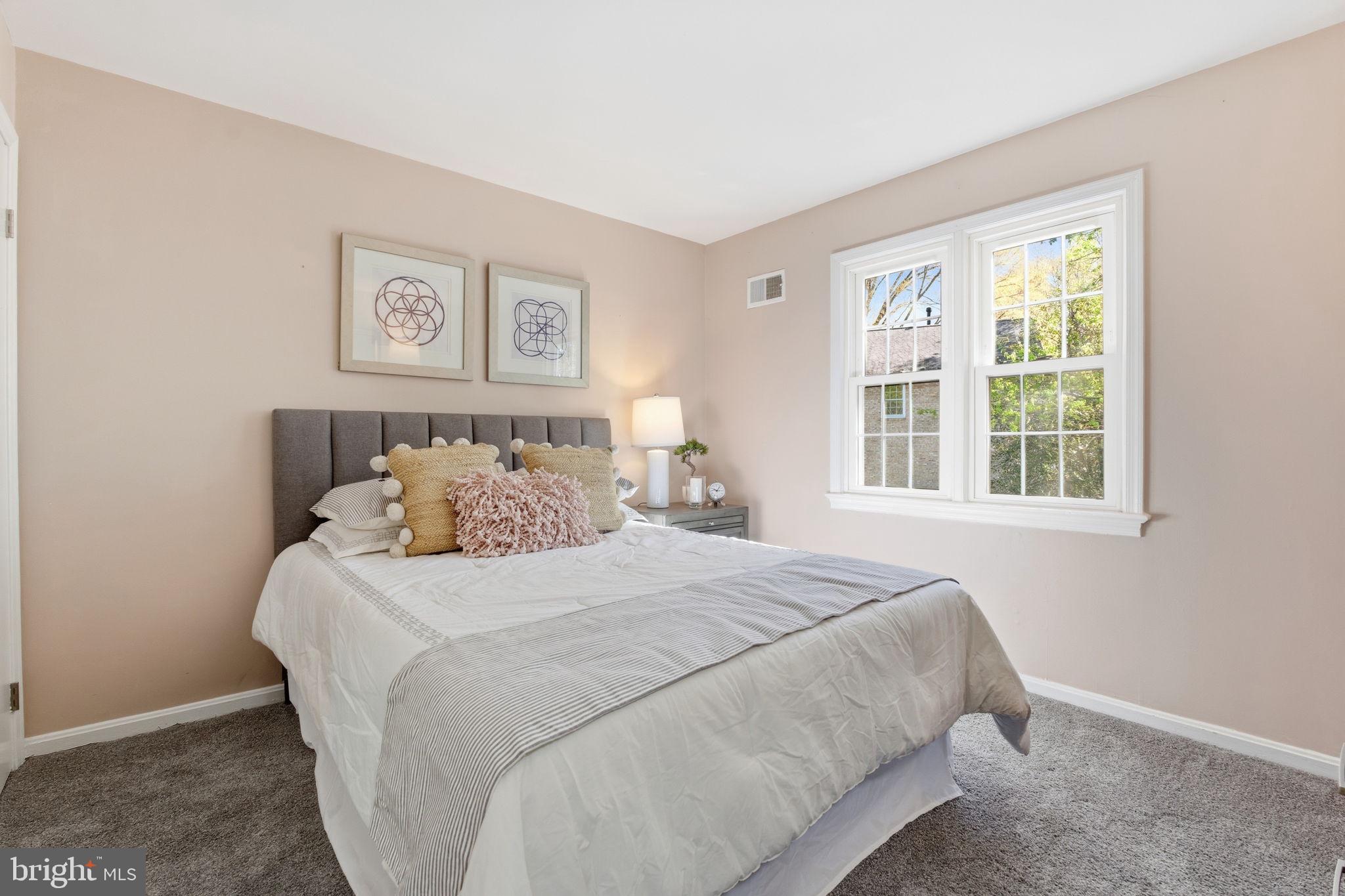 15101 Redgate Drive Silver Spring, MD 20905 - Photo 26 of 39 a bedroom with bed and a window