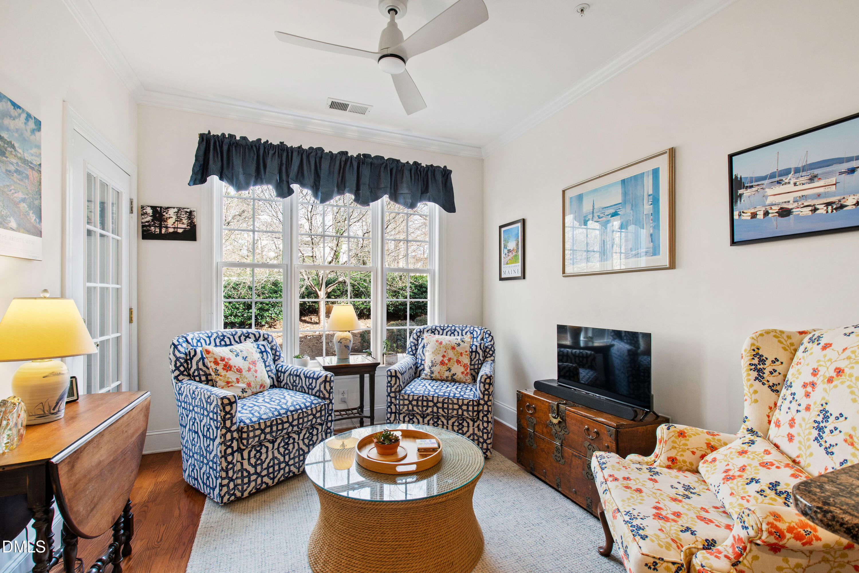 3700 Baron Cooper Pass, Unit 105 Raleigh, NC 27612 - Photo 6 of 49 a living room with furniture fireplace and a large window