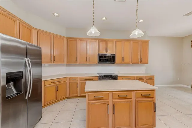 a spacious bathroom with a granite countertop sink mirror and