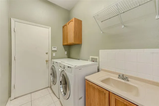 a view of a large building next to a yard with an outdoor seating