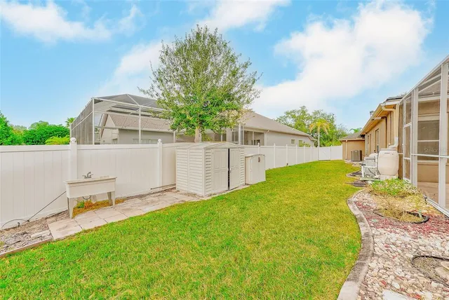 a view of a backyard with swimming pool