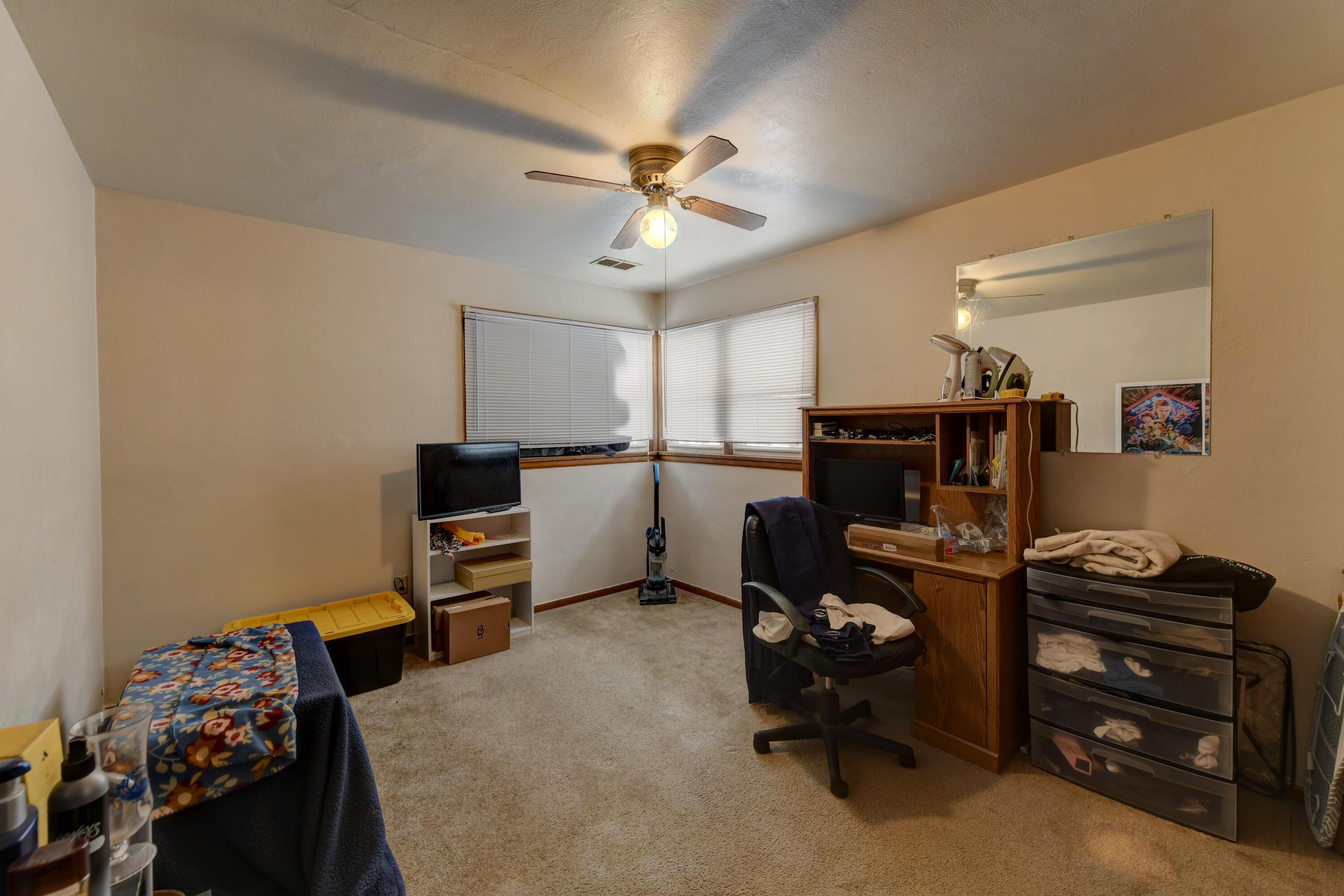 902 North Wood Street Griffith, IN 46319 - Photo 15 of 17 a bedroom with furniture and a chandelier