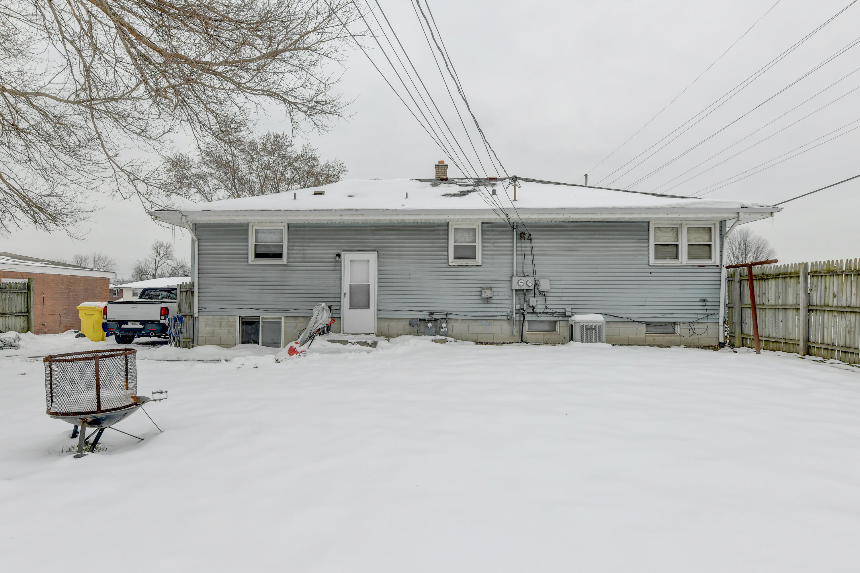 902 North Wood Street Griffith, IN 46319 - Photo 2 of 17 a view of a kitchen with a snow on a table and chairs