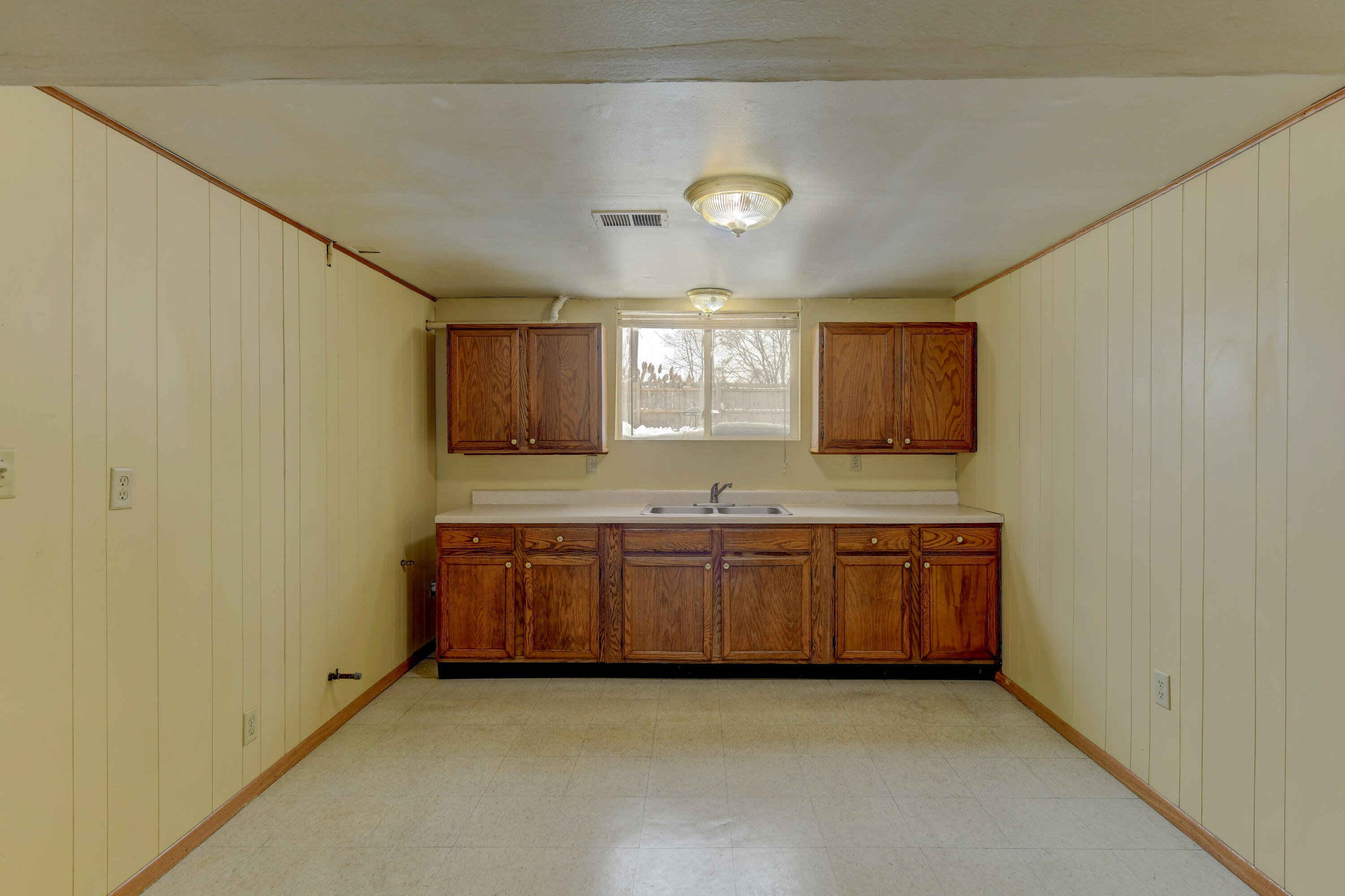 902 North Wood Street Griffith, IN 46319 - Photo 4 of 17 a large kitchen with granite countertop a sink and dishwasher a stove with wooden floor