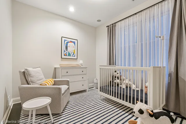 a bedroom with furniture and a window
