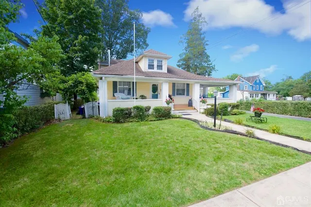 a front view of house with yard and green space