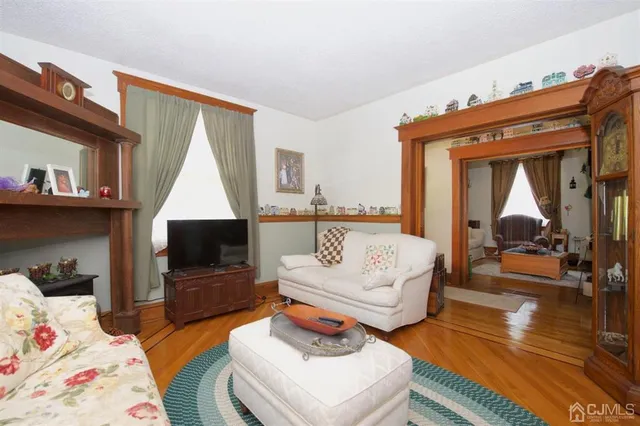 a bedroom with a bed and a mirror