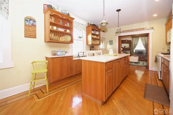 a view of a room that has a table and chairs