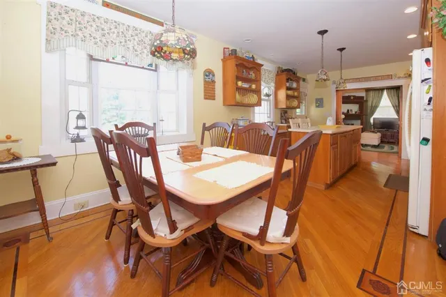 a bedroom with a bed and painting on the wall