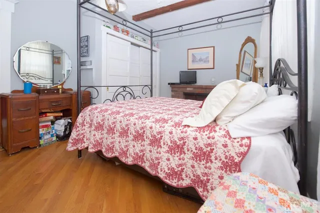 a view of a house with backyard sitting area and garden