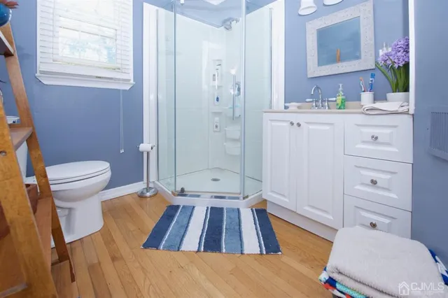 a front view of a house with garden and sitting area