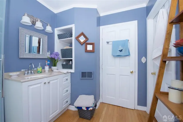 a view of a livingroom with furniture and hardwood floor