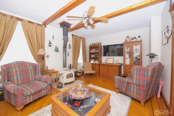 a living room with furniture a couch and a window