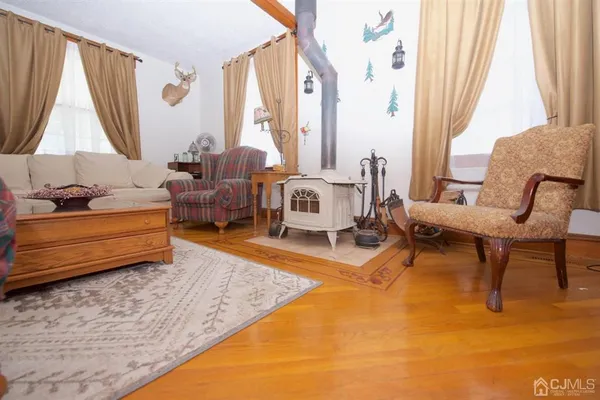 a view of a dining room with furniture and a chandelier