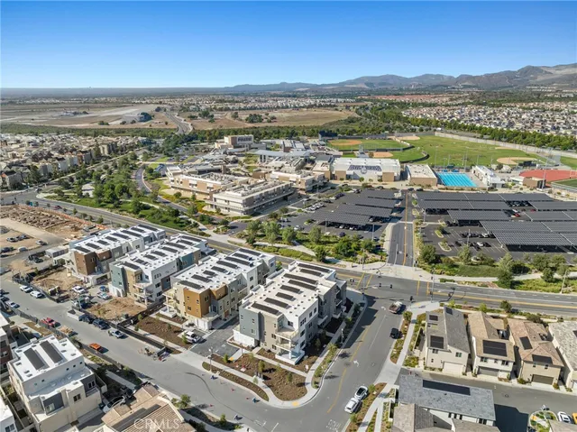 an aerial view of a city with ocean view