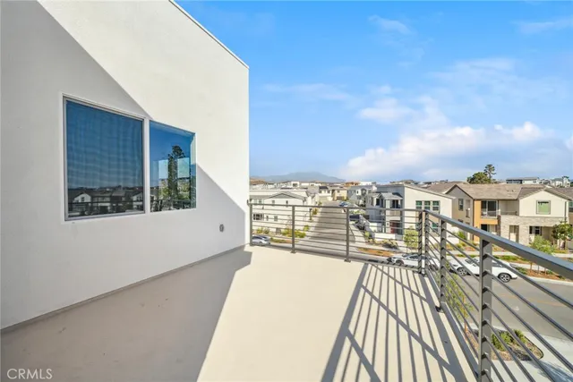 a view of a balcony with wooden floor and city view