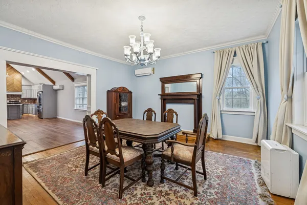 a view of living room with furniture and fireplace